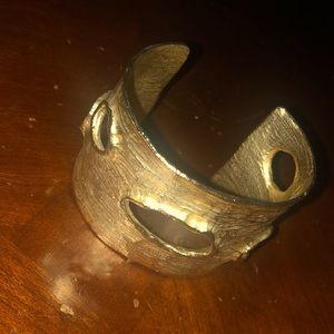 a Chico’s gold bracelet cuff